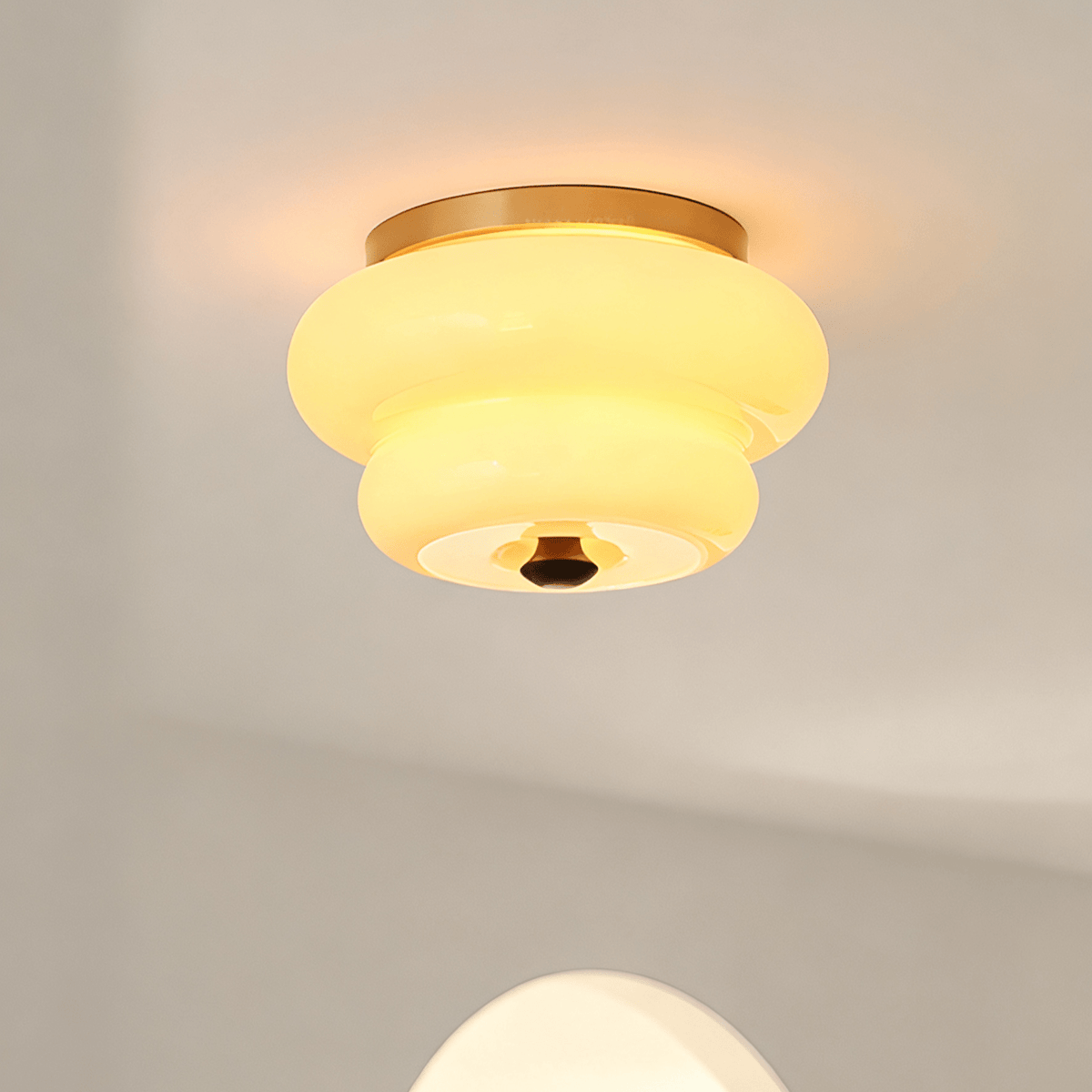 Curvaceous Flush Mount Ceiling Light with Gold Accents and Glass Shade