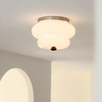 Curvaceous Flush Mount Ceiling Light with Gold Accents and Glass Shade