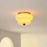 Curvaceous Flush Mount Ceiling Light with Gold Accents and Glass Shade