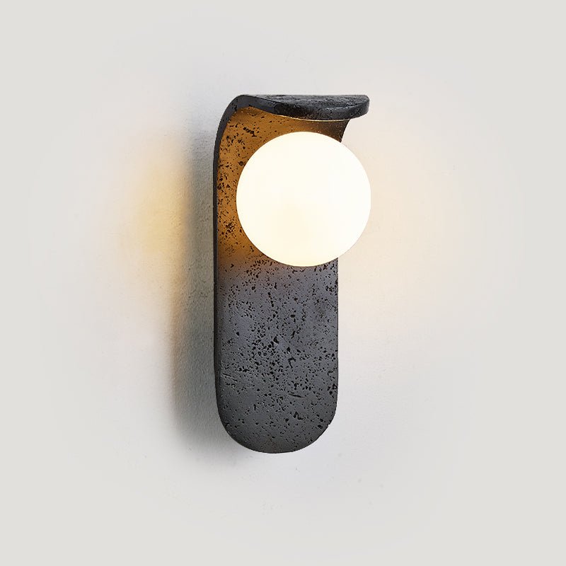 Eclipse Orb Wall Sconce in Black Travertine with Opal Glass Shade