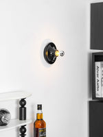 Eclipta Wall Sconce – Sculptural Metal & Glass Halo Light for Modern Interiors