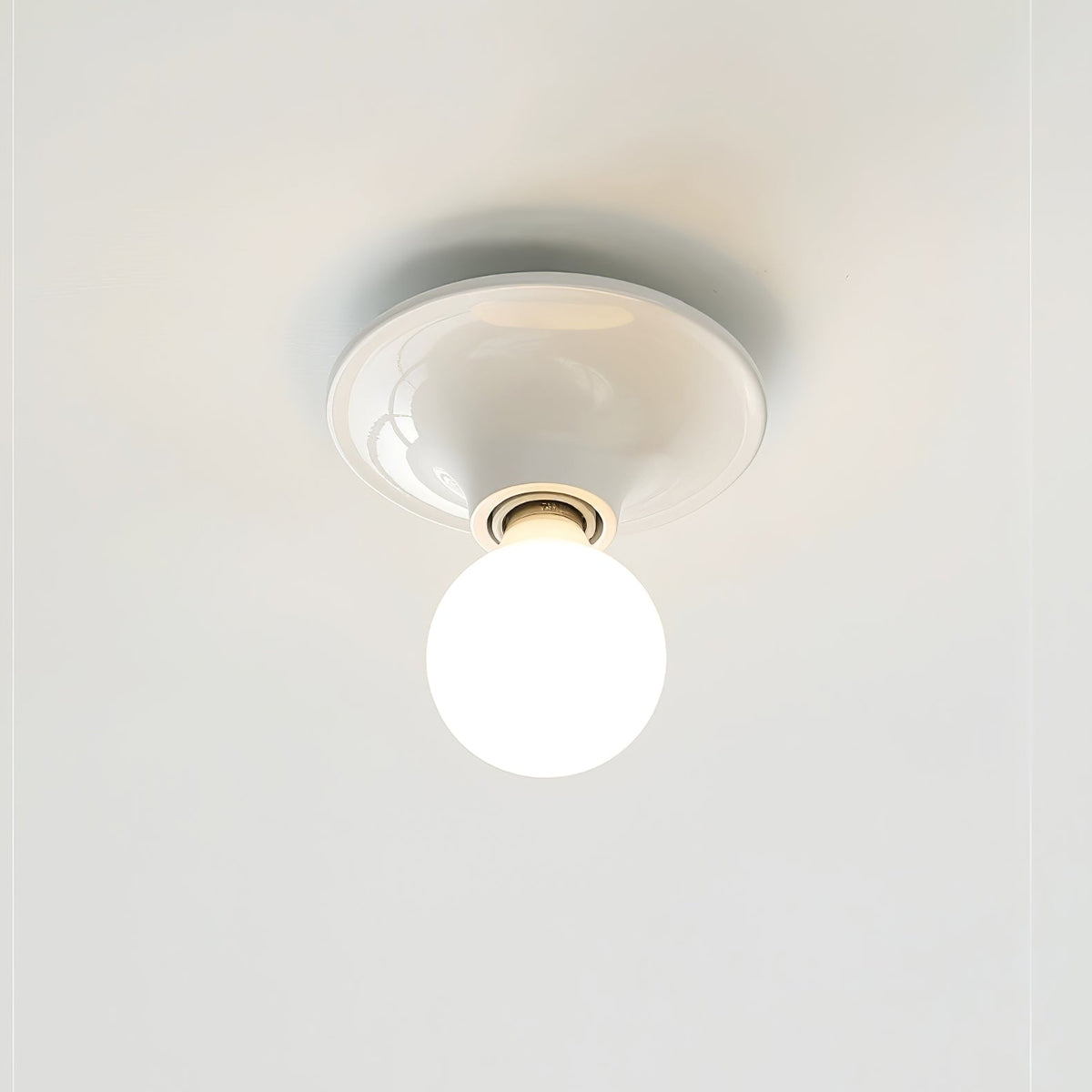 Eclipta Wall Sconce – Sculptural Metal & Glass Halo Light for Modern Interiors