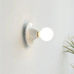 Eclipta Wall Sconce – Sculptural Metal & Glass Halo Light for Modern Interiors