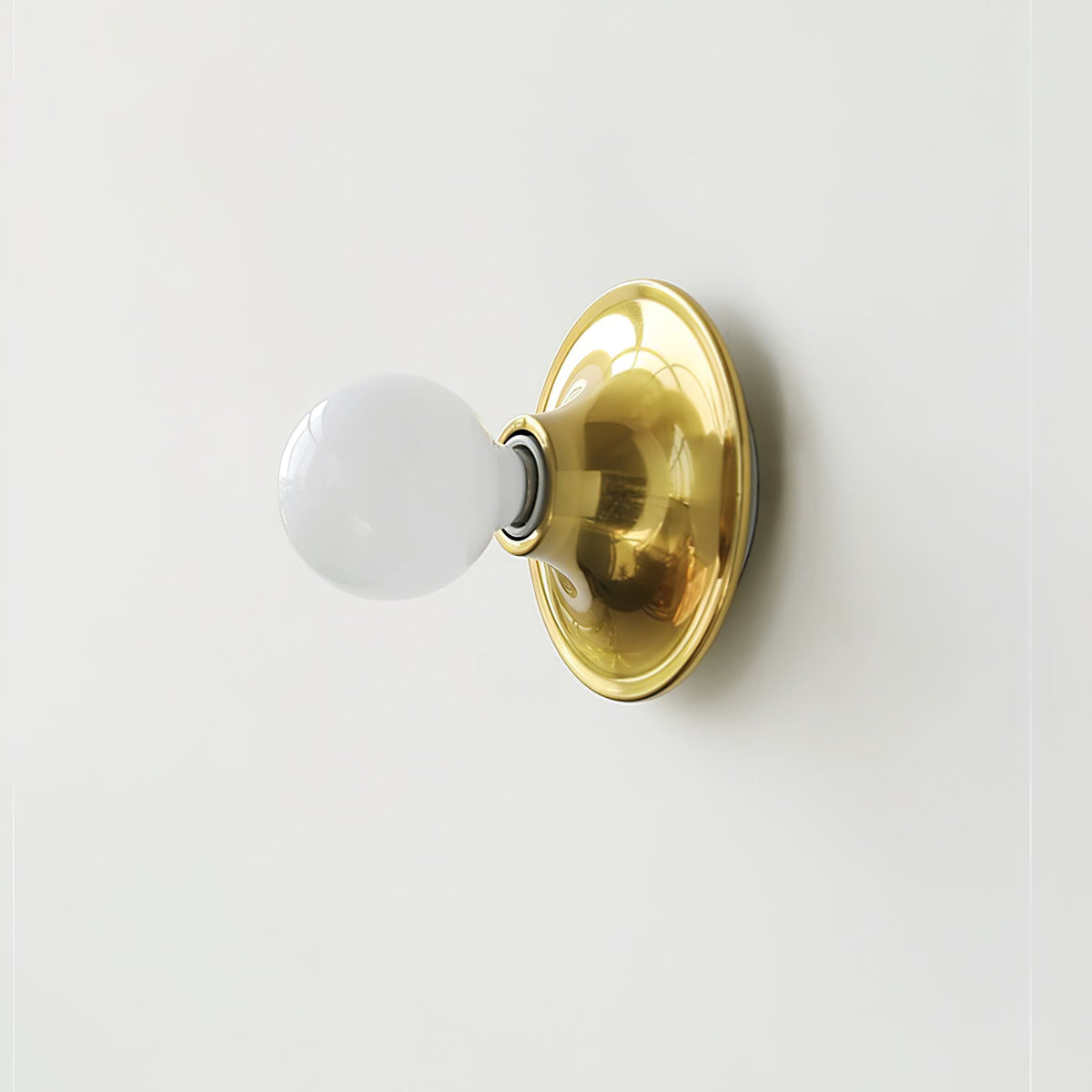 Eclipta Wall Sconce – Sculptural Metal & Glass Halo Light for Modern Interiors