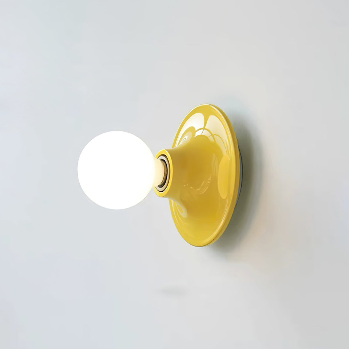 Eclipta Wall Sconce – Sculptural Metal & Glass Halo Light for Modern Interiors