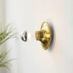 Eclipta Wall Sconce – Sculptural Metal & Glass Halo Light for Modern Interiors