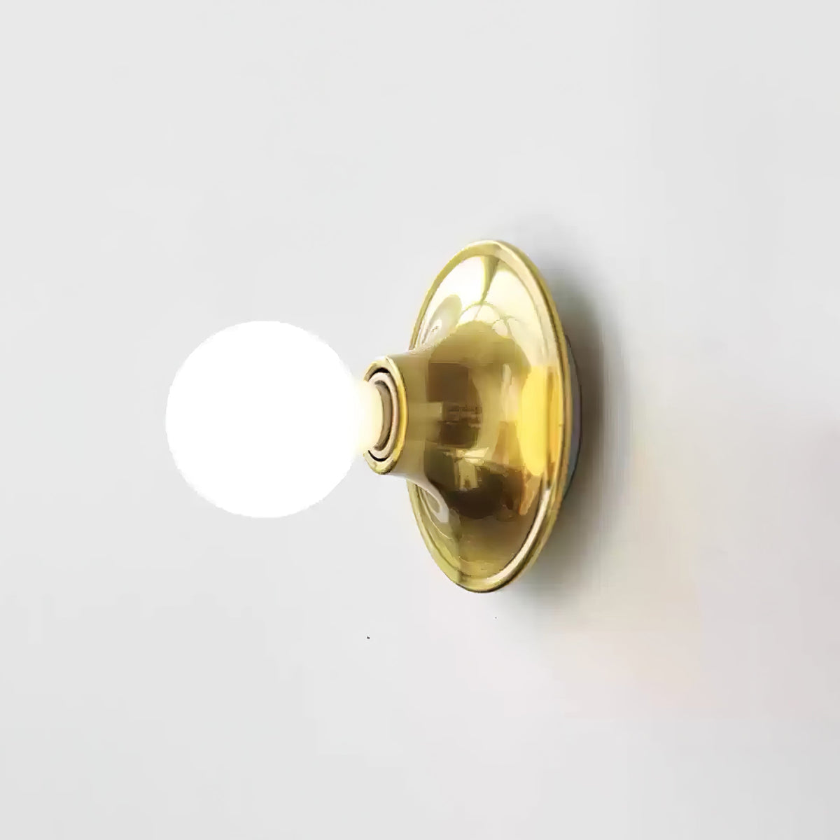 Eclipta Wall Sconce – Sculptural Metal & Glass Halo Light for Modern Interiors