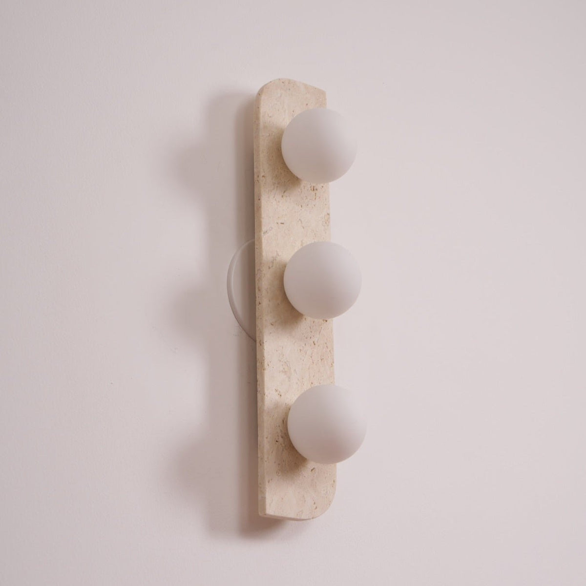 Elysian Travertine Wall Sconce with Glass Globes – Modern Natural Stone Lighting