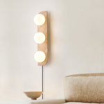 Elysian Travertine Plug-in Wall Sconce with Glass Globes