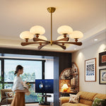 Evander Ray Modern Wood and Brass Chandelier with Glass Shades