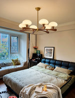 Evander Ray Modern Wood and Brass Chandelier with Glass Shades