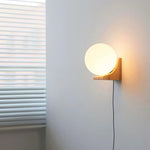 Evelyn Orb Plug-in Wall Sconce in Natural Oak and Dark Walnut