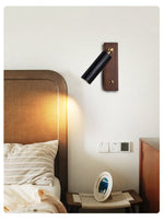 Event Horizon Adjustable Wall Sconce in Black Travertine and Brass
