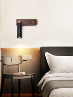 Event Horizon Adjustable Wall Sconce in Black Travertine and Brass