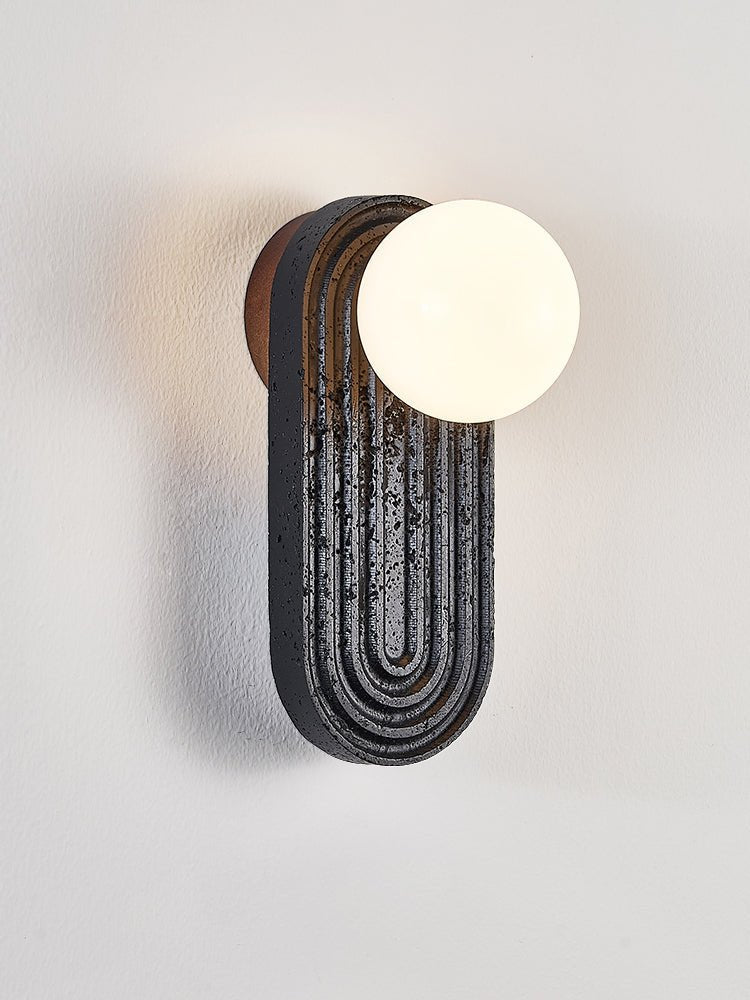 Eventide Orb Wall Sconce in Black Travertine with Opal Glass Globe