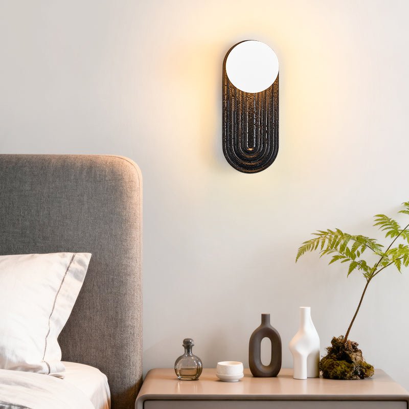 Eventide Orb Wall Sconce in Black Travertine with Opal Glass Globe