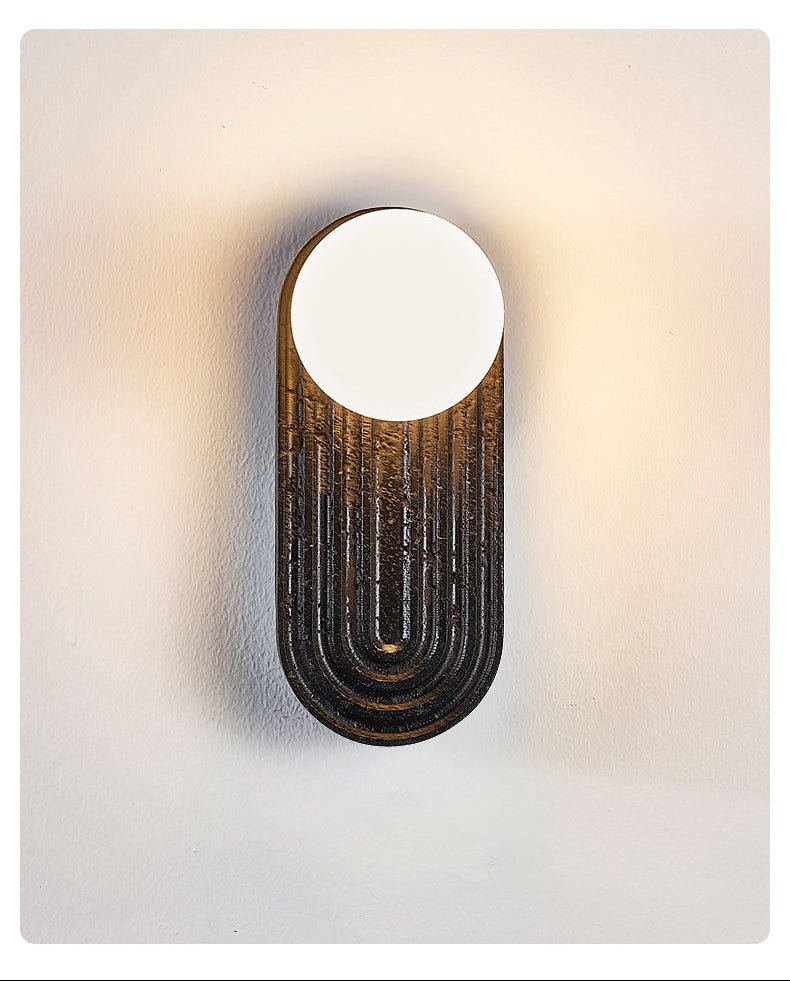 Eventide Orb Wall Sconce in Black Travertine with Opal Glass Globe