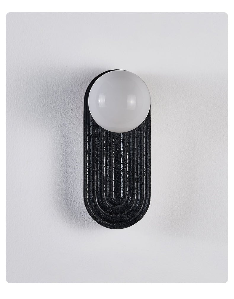 Eventide Orb Wall Sconce in Black Travertine with Opal Glass Globe