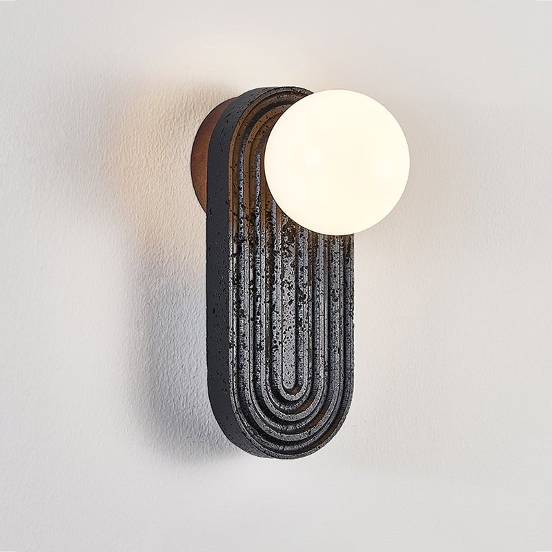 Eventide Orb Wall Sconce in Black Travertine with Opal Glass Globe