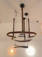Finopi Linear LED Chandelier with Twisted Metal Rings and Leather Accents