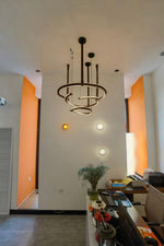 Finopi Linear LED Chandelier with Twisted Metal Rings and Leather Accents