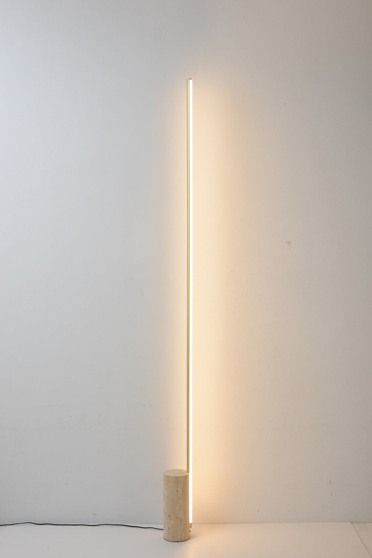 Linear LED Floor Lamp with Travertine Base for Modern Interiors