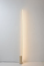 Linear LED Floor Lamp with Travertine Base for Modern Interiors