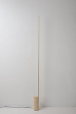 Linear LED Floor Lamp with Travertine Base for Modern Interiors