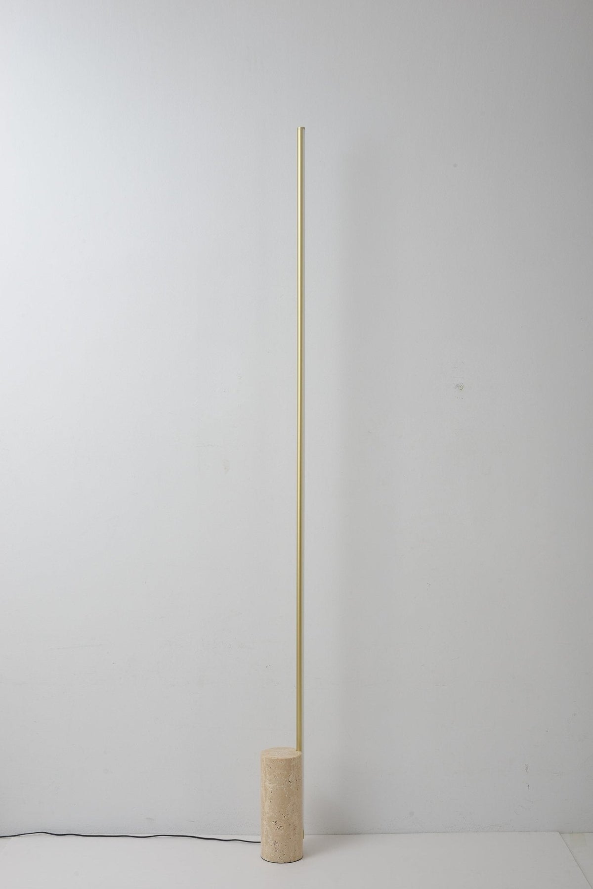 Linear LED Floor Lamp with Travertine Base for Modern Interiors