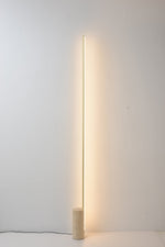Linear LED Floor Lamp with Travertine Base for Modern Interiors