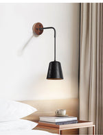 Jorren Wall Sconce in Black Travertine and Walnut