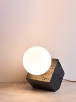 Kryden Sculptural Table Lamp in Black Travertine with Glass Globe