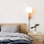 Atlas Globe Wall Sconce in Travertine and Opal Glass