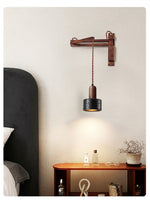 Swing Arm Wall Sconce in Black Travertine and Walnut