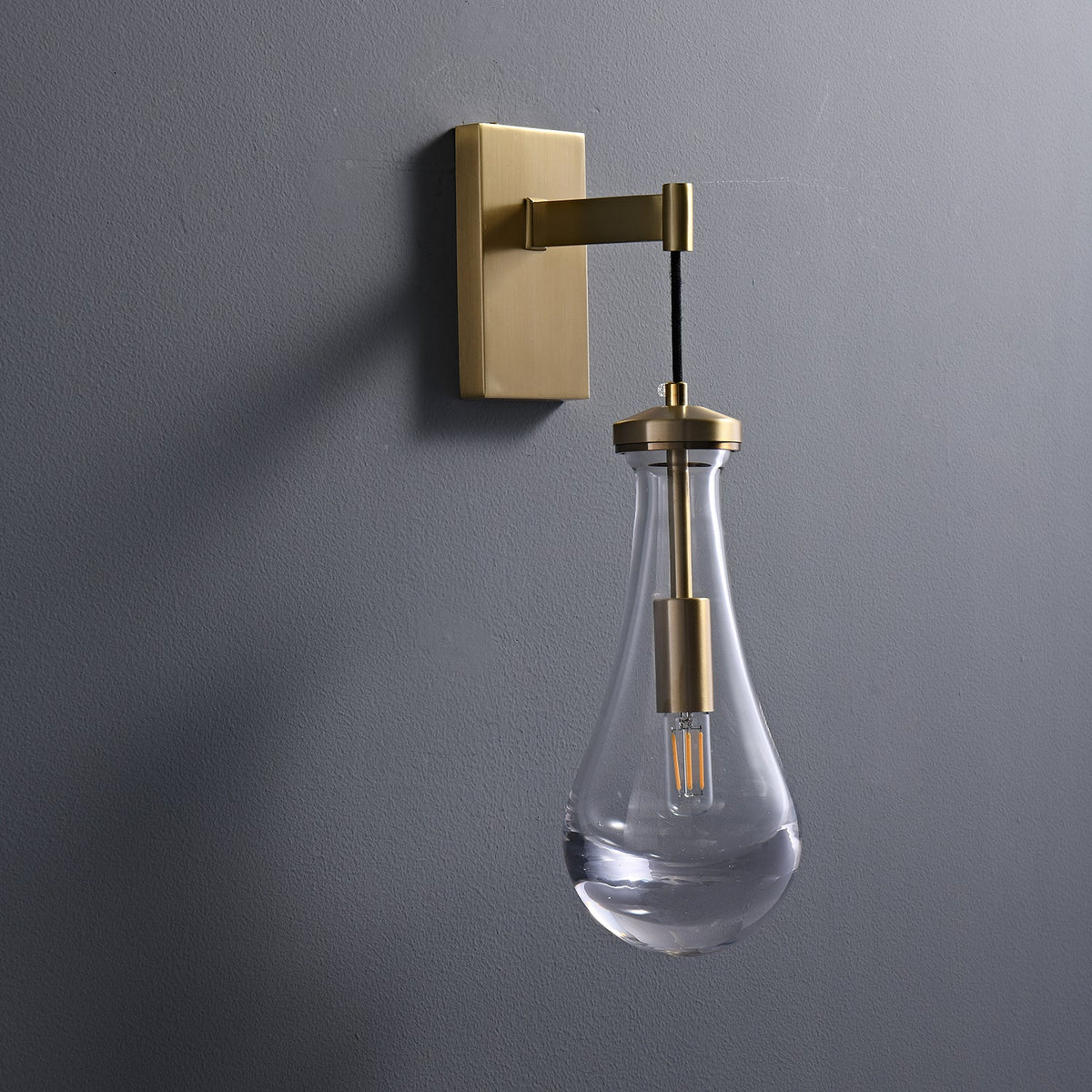 Leontine Brass Glass Teardrop Wall Sconce for Modern Interiors