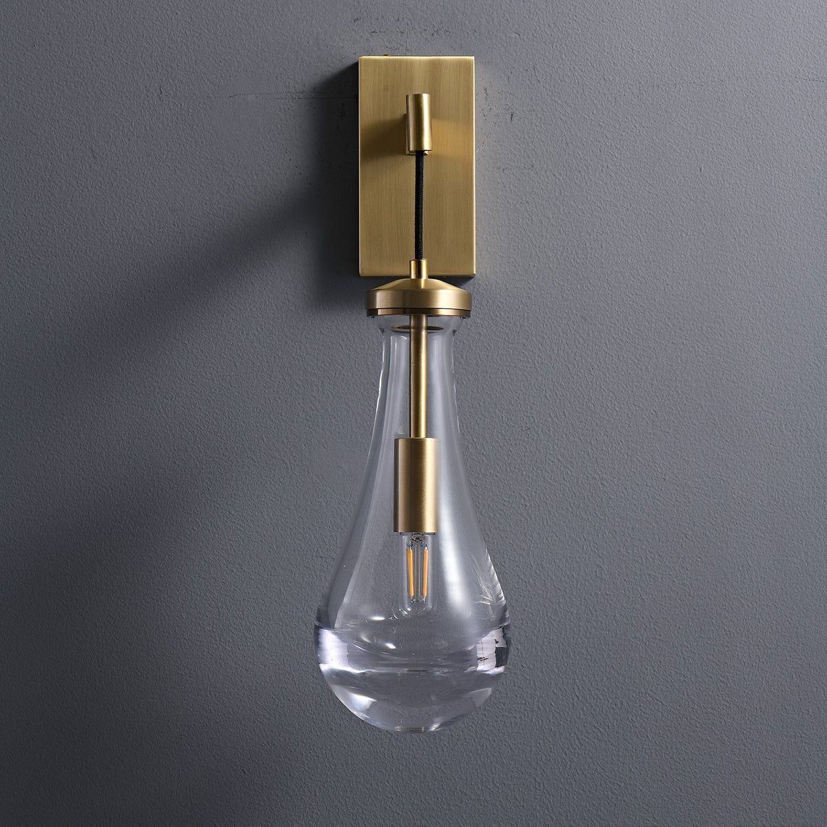 Leontine Brass Glass Teardrop Wall Sconce for Modern Interiors