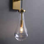 Leontine Brass Glass Teardrop Wall Sconce for Modern Interiors