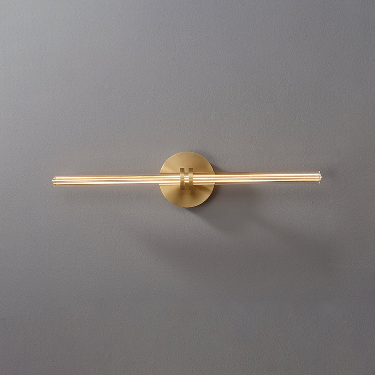 Linear Filament Wall Sconce in Brass and Glass for Modern Interiors