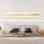 Lior Sculptural Travertine LED Wall Sconce for Modern Interiors