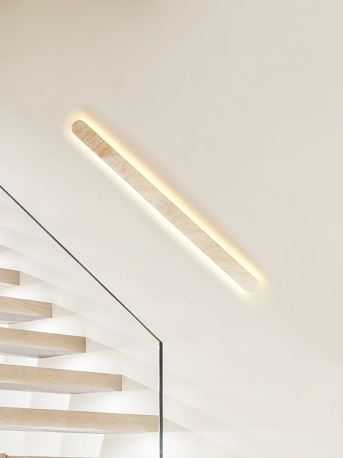 Lior Sculptural Travertine LED Wall Sconce for Modern Interiors