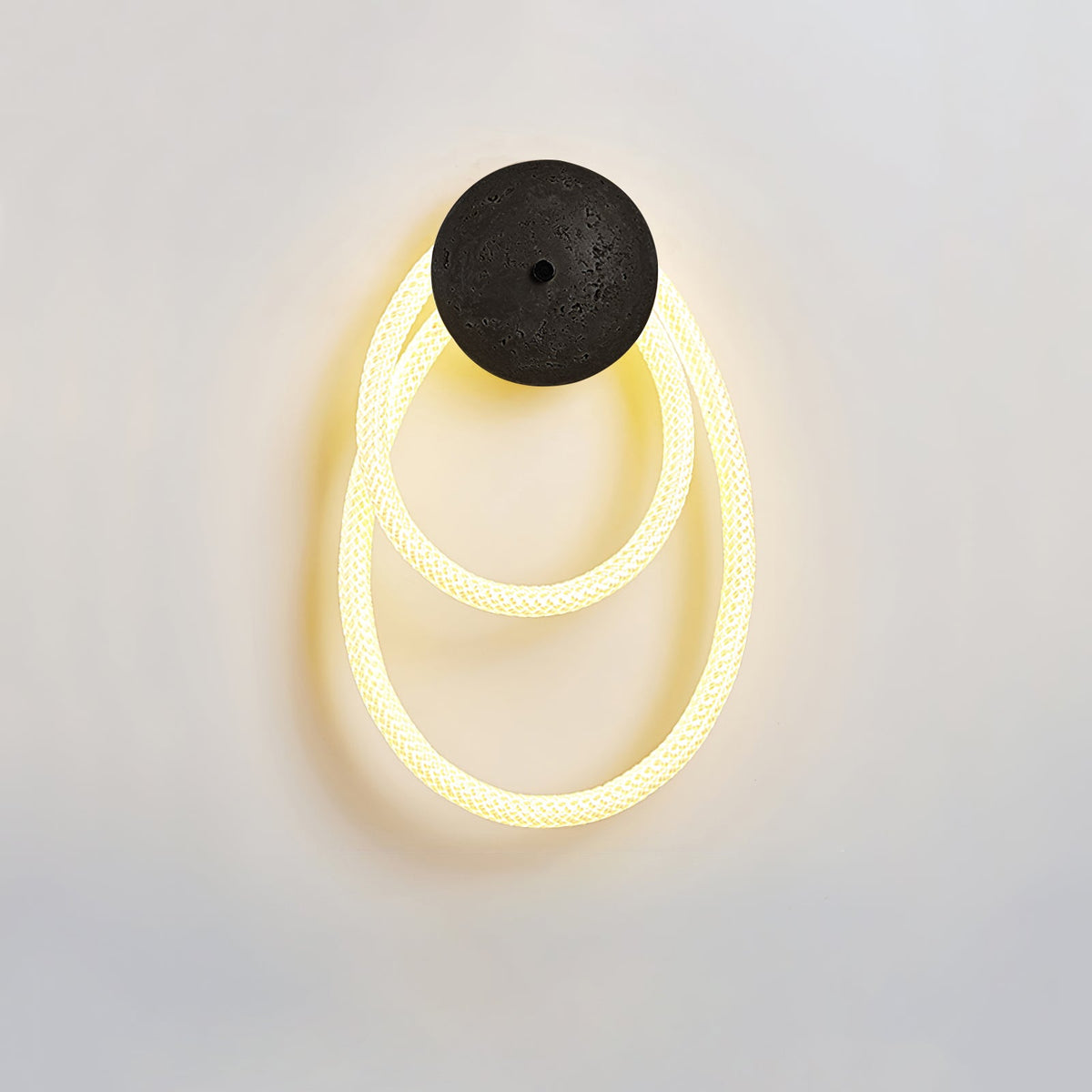 Loop Wall Sconce in Natural Travertine with Braided LED Light