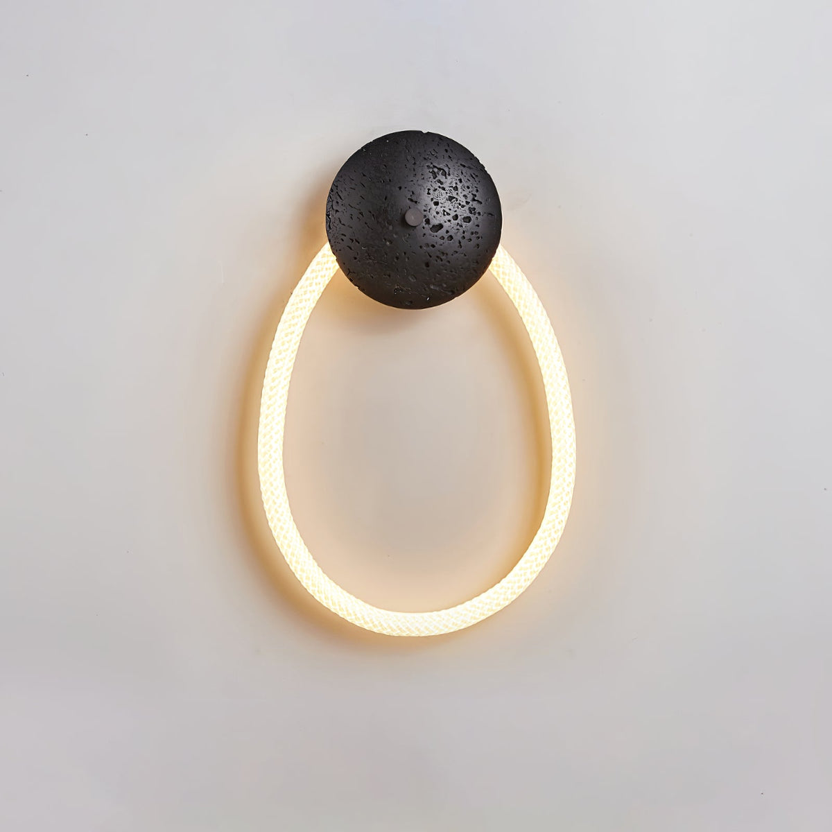 Loop Wall Sconce in Natural Travertine with Braided LED Light