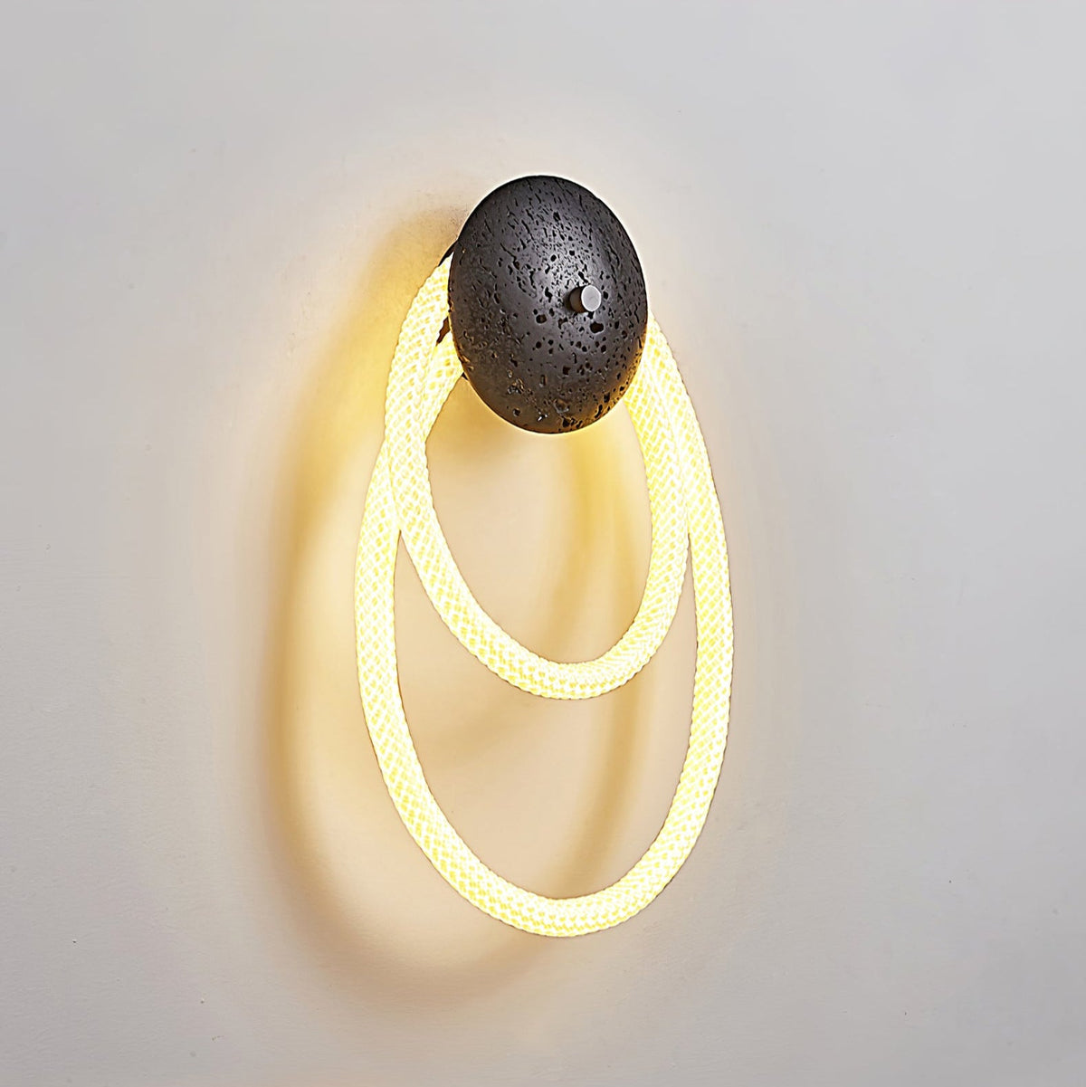 Loop Wall Sconce in Natural Travertine with Braided LED Light