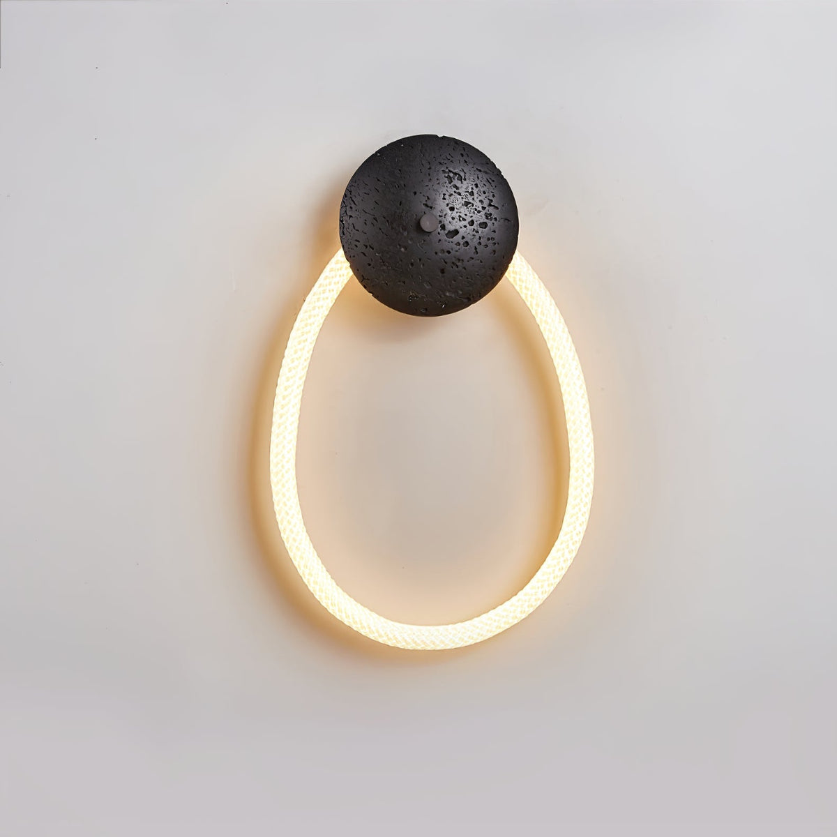 Loop Wall Sconce in Natural Travertine with Braided LED Light