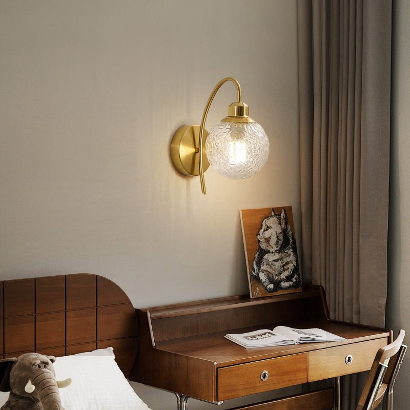 Lucienne Curved Wall Sconce in Gold with Clear Glass Globe