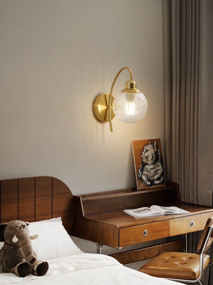 Lucienne Curved Wall Sconce in Gold with Clear Glass Globe