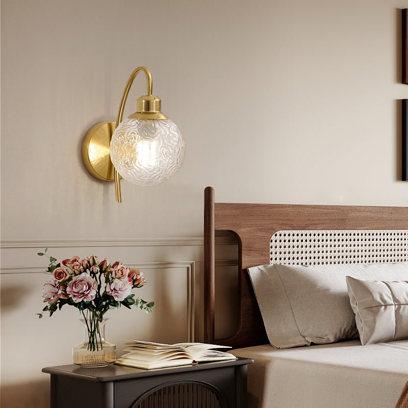 Lucienne Curved Wall Sconce in Gold with Clear Glass Globe