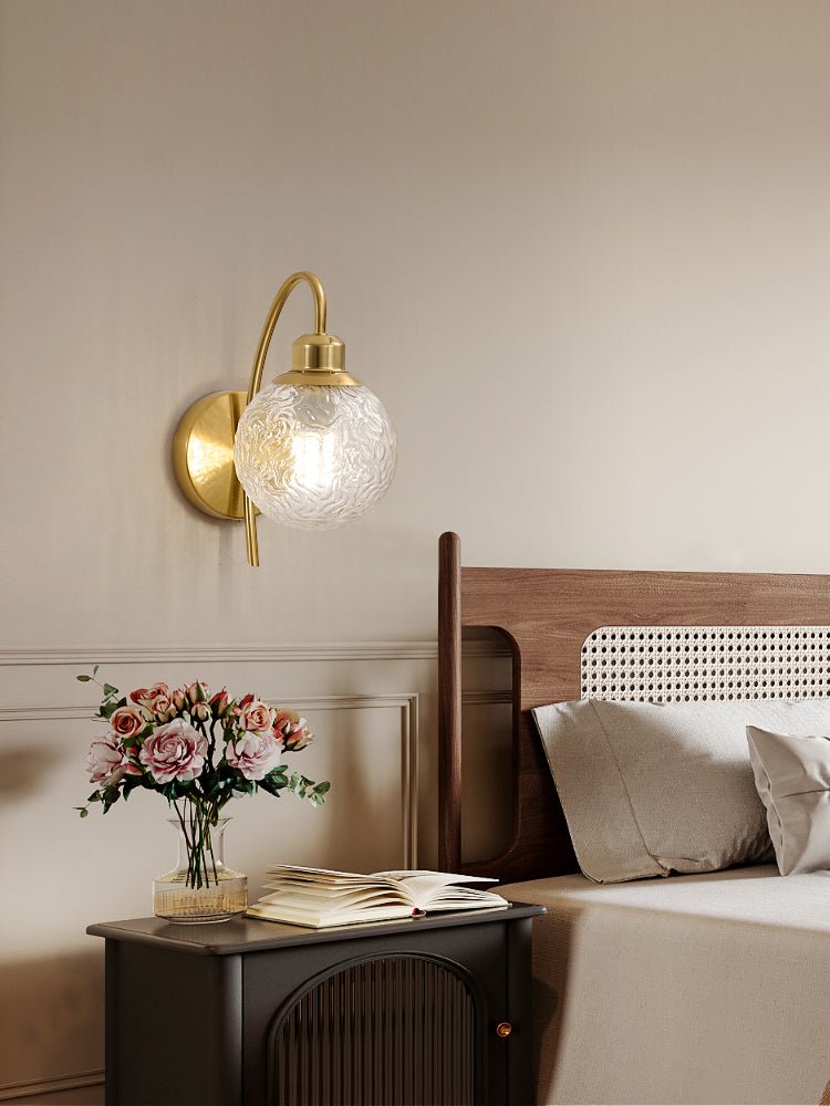 Lucienne Curved Wall Sconce in Gold with Clear Glass Globe