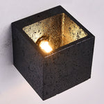 Lumina Void Sconce — Black Travertine Wall Light with Warm Glow