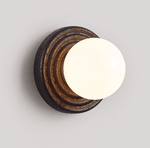 Lunara Black Travertine Wall Sconce with Opal Glass Globe